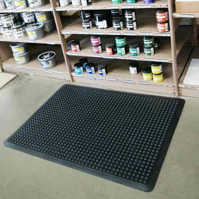 Black corner with black bubble pattern inside a warehouse