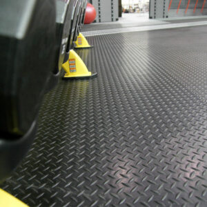 Diamond plate underneath weights and its holders at floor level