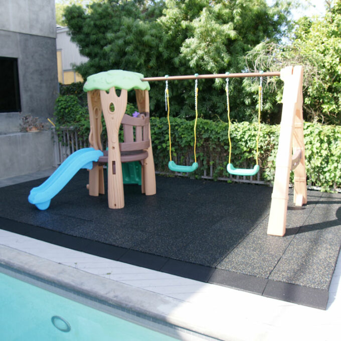 Playground with black tile outdoors