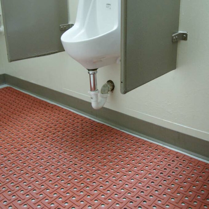 Grease-Resistant Rubber Mat red color placed on bathroom surface