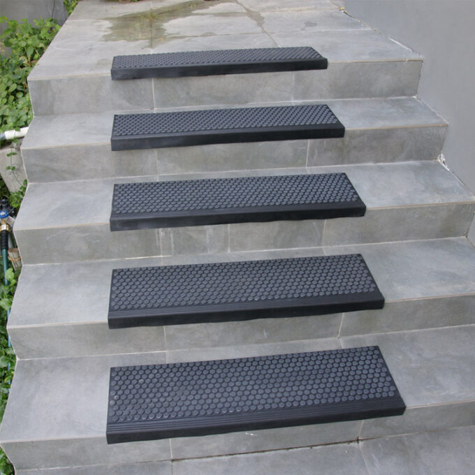 Black in color 6mm thick rubber steps to increase comfort, lessen impact, and withstand constant daily foot traffic on staircase