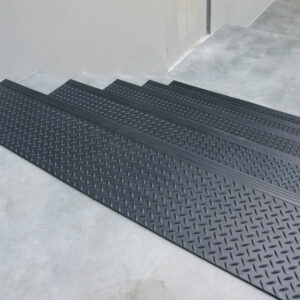 “Diamond-Plate” textured black in color step mats placed on steps