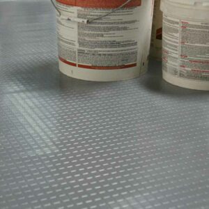 Dark Grey Block Grip flooring under Paint cans