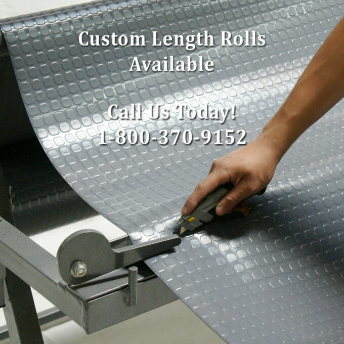 Dark Grey color block grip flooring available in custom length person is cutting the flooring