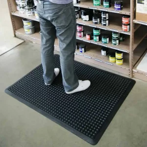 Black in color One-of-a-Kind Cushioned Mat Built for Comfort and Durability man standing