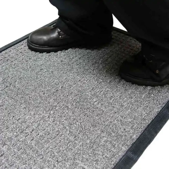 Grey mat with person standing on it