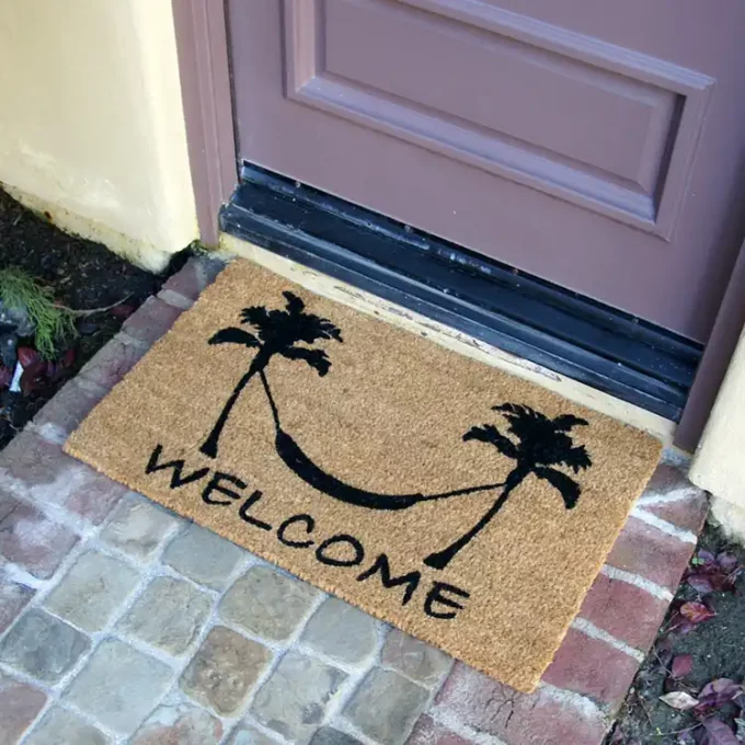 Doormat with two trees and a hammock