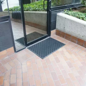 Black bowtie pattern with black border outside an entrance