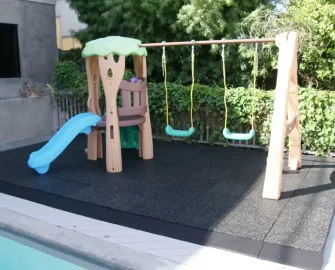 Playground with black tile outdoors