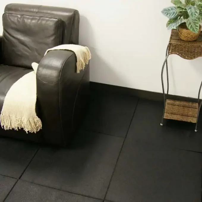 Black color Ultra Durable, DIY Rubber Tiles placed under couch