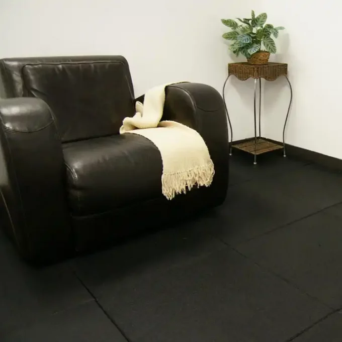 Black color Ultra Durable, DIY Rubber Tiles placed under couch