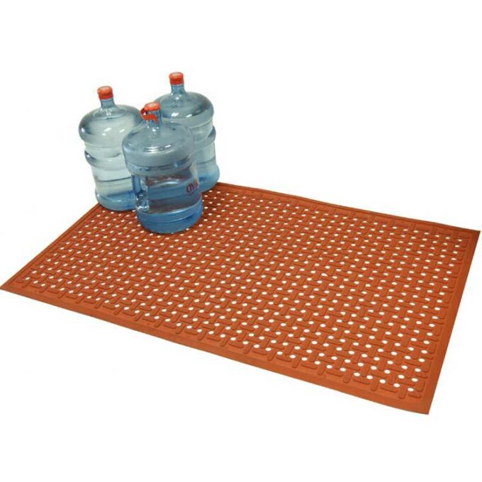 Orange kitchen mat with 3 water containers of 3 gallon size on the top left side of the carpet.