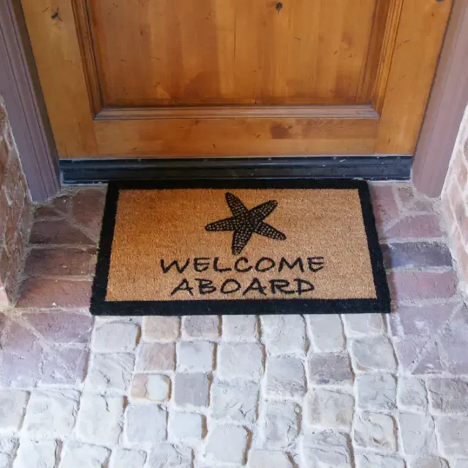 Welcome Aboard sign with sea side shell