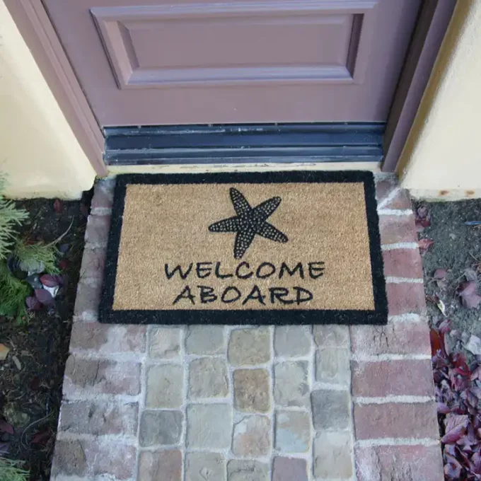 Welcome Aboard sign with sea side shell