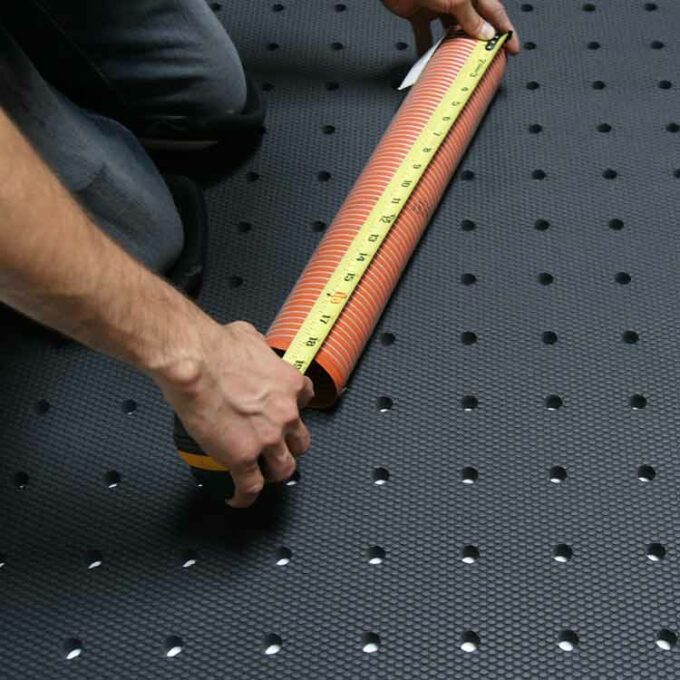 Black in color Grease-Resistant Anti-Slip Mat with a 3/4" Thick Comfort Layer taking measurements