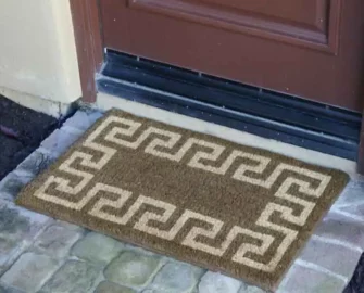 The doormat in brown & tan color combination design around the border at front door