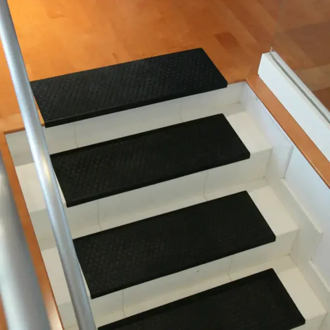 Black color Non-Slip, Ultra Durable, Indoor/Outdoor Stair Treads placed on staircase
