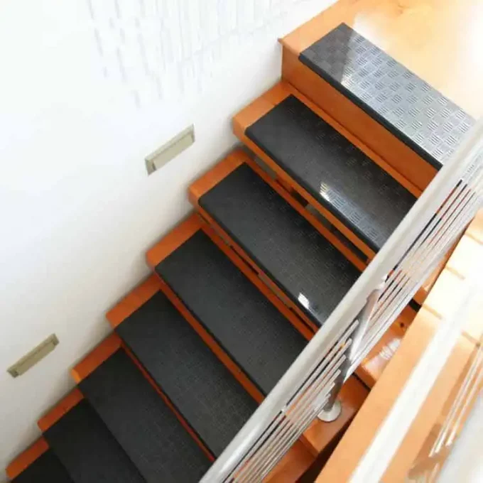 Black color Long-Lasting, Slip-Resistant Rubber Step Mats for Stairs placed on staircase