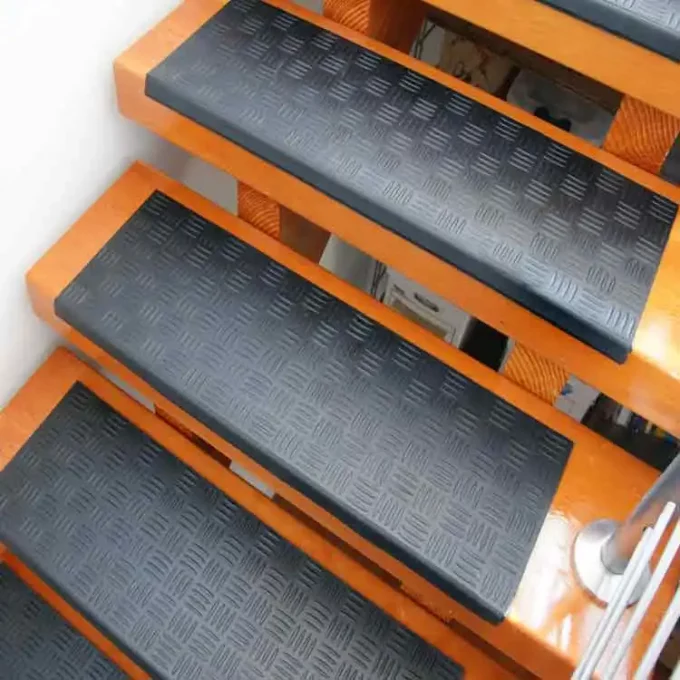 Long-Lasting, Slip-Resistant Rubber Step Mats for Stairs placed on staircase black in color