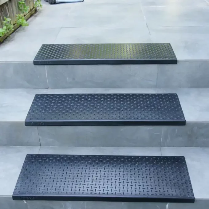 Non-Skid, Affordable, Sturdy and Eco-Friendly Step Mats black in color placed on staircase