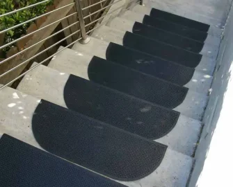 Black recycled rubber stair mats with anti slip texture placed on staircase