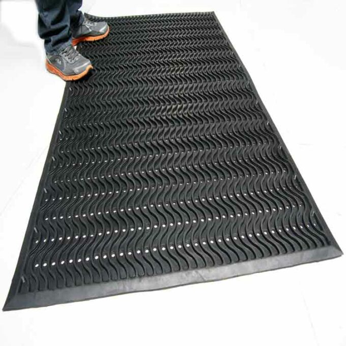 Black Color Commercial Entrance Mat, Promotes Safety and Slip-Protection man standing