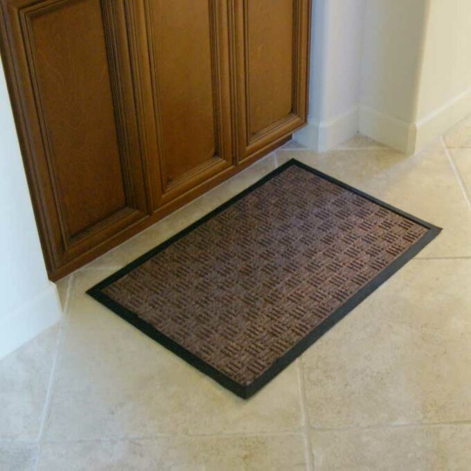 Brown Versatile Welcome Mat Traps Dirt and Prevents Slips placed at front door