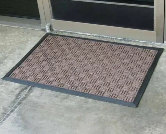 Outdoor black outlined mat with red in middle with a square alternating pattern