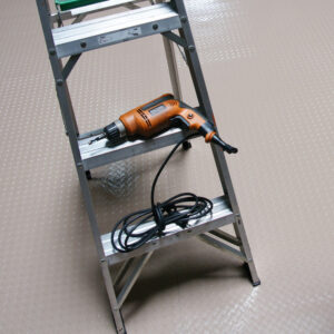 Durable PVC Flooring with a Unique Metallic Color beige placed on floor a metal ladder placed on it
