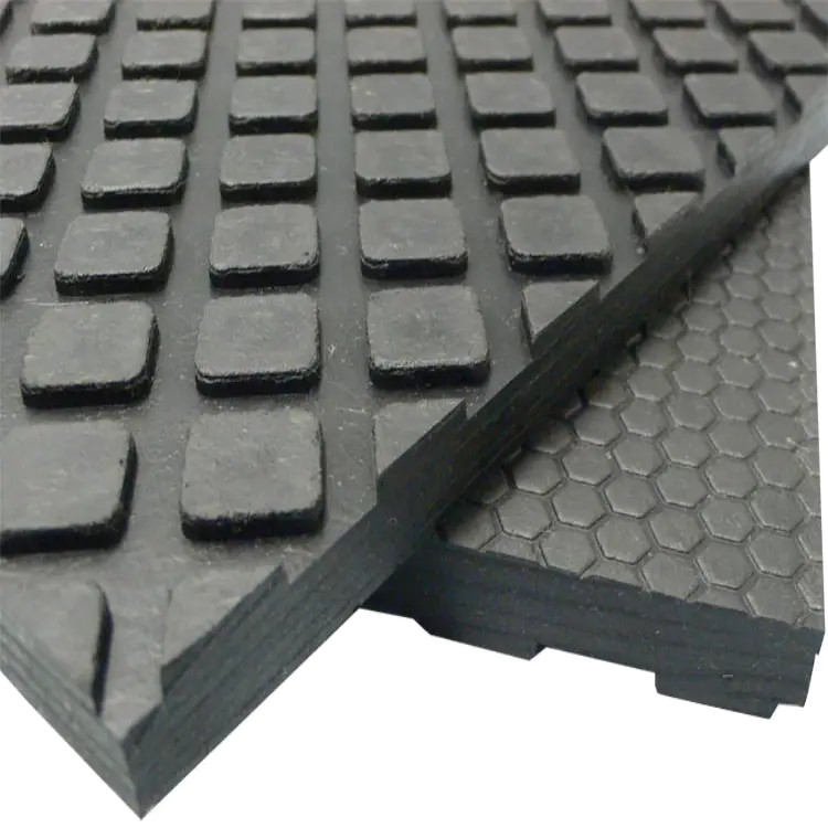 Two Maxx Tuff Tiles Up Close with Rectangular Texture Pattern