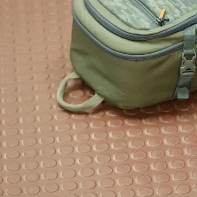 Coin pattern flooring brown color backpack is kept
