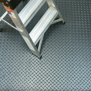 Stairs on top of a diamond plate black mat