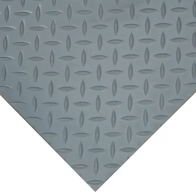 Diamond plate gray corner in front of a white background