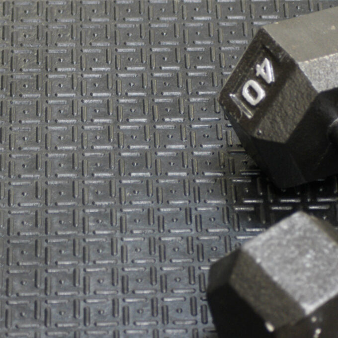 Black in color Thick Rubber Mat Designed for Impact-Heavy Applications dumbells kept