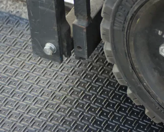 Black mat with squarse and inside with a dot over a truck