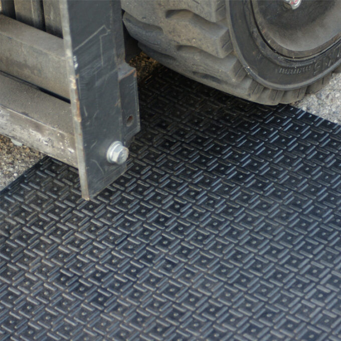 Black in color Thick Rubber Mat Designed for Impact-Heavy Applications heavy machinery kept