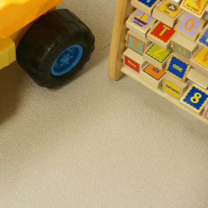 Chocolate Premium Interlocking Rubber Floor Tile placed in children's play room under toys