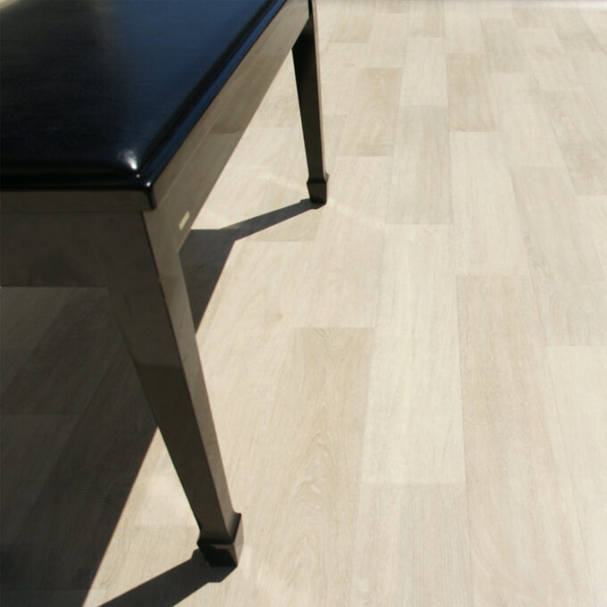 Vinyl Sheet Floors in colonial oak finish a tray chair placed on top