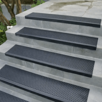 Coin Grip black in color step mat placed on stairs