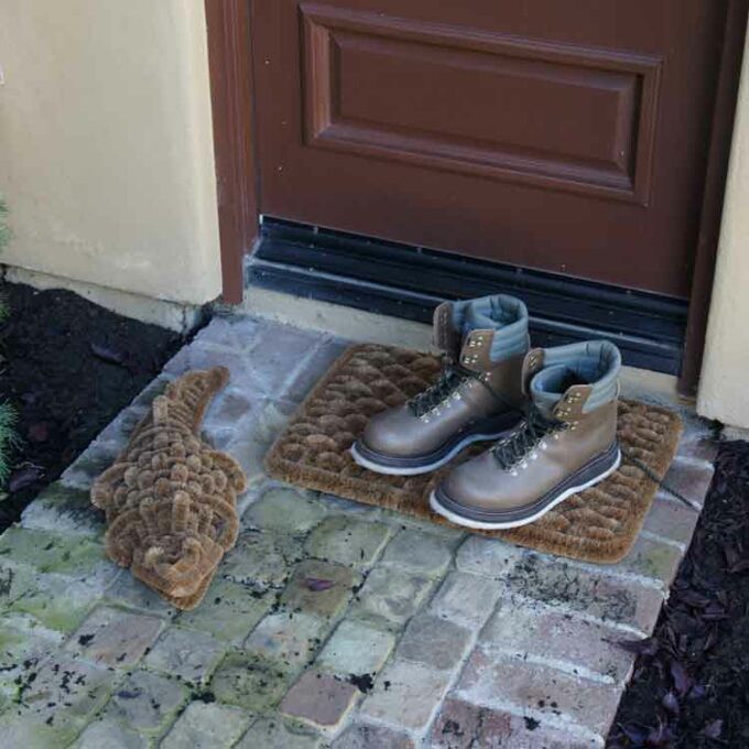 Boot scraper doormat in shape of alligator at front door