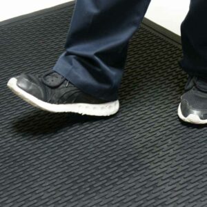 Black color Ultra-Durable and Economical Rubber Doormat man standing