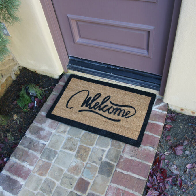 Welcome Mat with modern ribbon style script