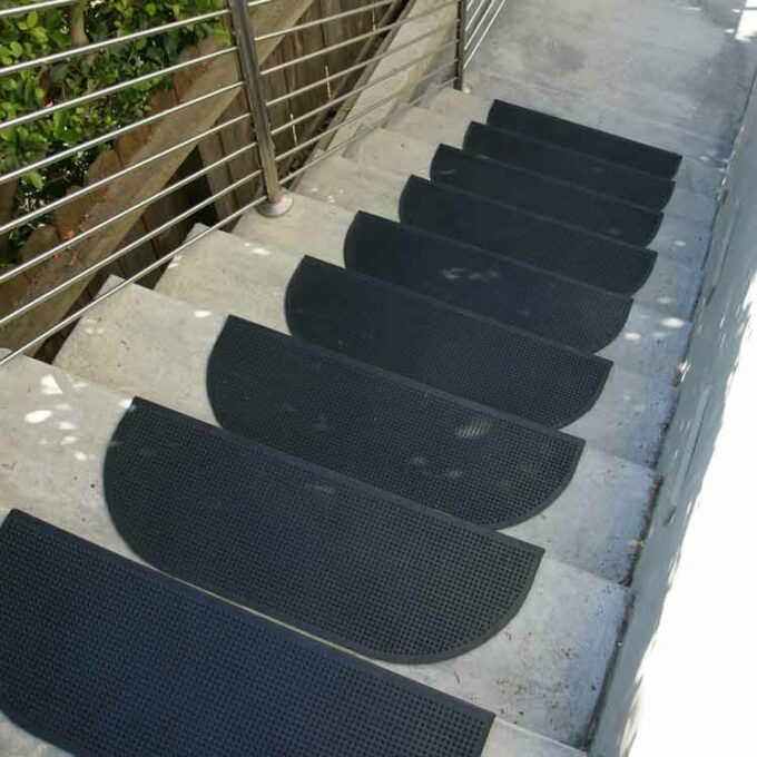 Black recycled rubber stair mats with anti slip texture placed on staircase