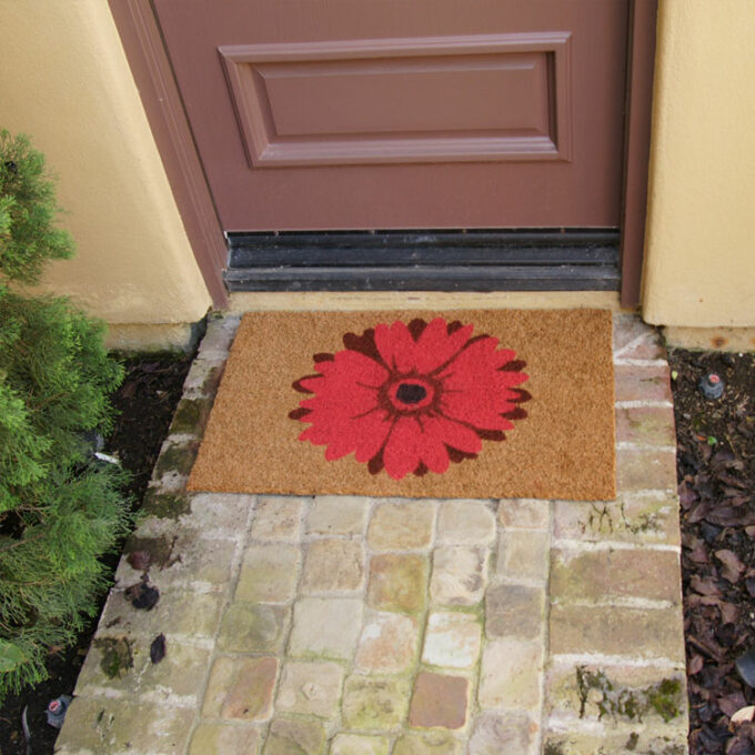 Red flower design with brown around it on a brown matt