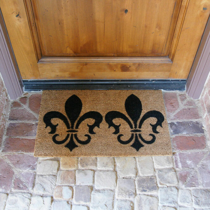The door mat with picture of pair of coat of arms at front door