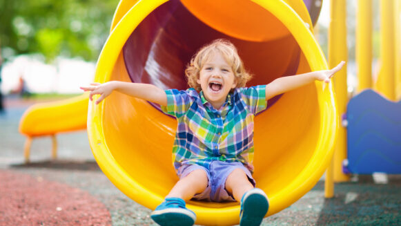 Kid Having Fun on the Slide